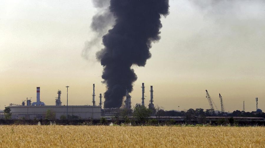 A dark plume of smoke rises up from a main oil refinery south of Tehran, Iran, Thursday, June 3, 2021. A massive fire broke out Wednesday night at the oil refinery serving Iran's capital, sending thick plumes of black smoke over Tehran. (AP Photo/Ebrahim Noroozi)