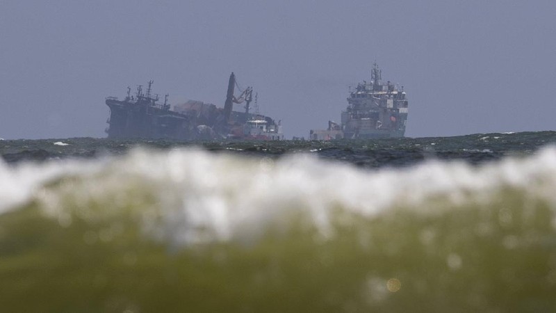 This photo provided by Sri Lankan Air Force shows the sinking MV X-Press Pearl at Kapungoda where it is anchored off Colombo port, Sri Lanka, Wednesday, June 2, 2021. Salvage experts were attempting to tow the fire-stricken container ship that had been loaded with chemicals into the deep sea as the vessel started to sink Wednesday. Water submerged the MV X-Press Pearl's quarterdeck a day after firefighters extinguished a blaze that had been burning for 12 days. (Sri Lanka Air Force via AP)