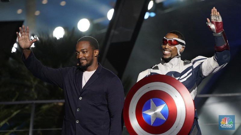 A fireworks display is presented as Paul Rudd, from left, Disney CEO Bob Chapek, Anthony Mackie, a Captain America character, Marvel President Kevin Feige and Josh D'Amaro, chairman, Disney parks, experiences and products appear on stage at the Avengers Campus dedication ceremony at Disney's California Adventure Park on Wednesday, June 2, 2021, in Anaheim, Calif. (AP Photo/Chris Pizzello)