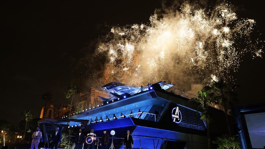A fireworks display is presented as Paul Rudd, from left, Disney CEO Bob Chapek, Anthony Mackie, a Captain America character, Marvel President Kevin Feige and Josh D'Amaro, chairman, Disney parks, experiences and products appear on stage at the Avengers Campus dedication ceremony at Disney's California Adventure Park on Wednesday, June 2, 2021, in Anaheim, Calif. (AP Photo/Chris Pizzello)