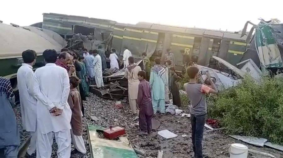 This image from a video, shows people gathering at the site of a train collision in Ghotki, Pakistan Monday, June 7, 2021. Two express trains collided in southern Pakistan early Monday, killing dozens of passengers, authorities said, as rescuers and villagers worked to pull injured people and more bodies from the wreckage. (AP Photo)