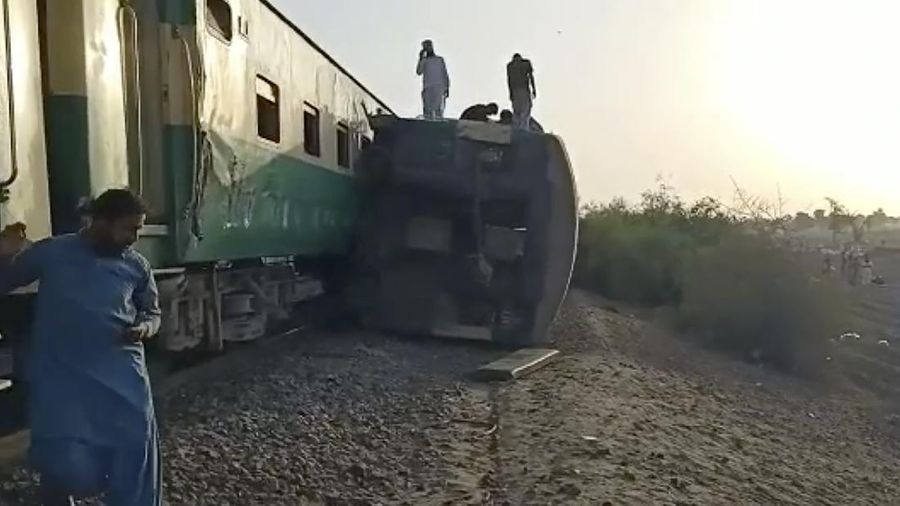 This image from a video, shows people gathering at the site of a train collision in Ghotki, Pakistan Monday, June 7, 2021. Two express trains collided in southern Pakistan early Monday, killing dozens of passengers, authorities said, as rescuers and villagers worked to pull injured people and more bodies from the wreckage. (AP Photo)