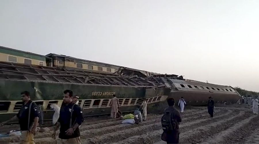 This image from a video, shows people gathering at the site of a train collision in Ghotki, Pakistan Monday, June 7, 2021. Two express trains collided in southern Pakistan early Monday, killing dozens of passengers, authorities said, as rescuers and villagers worked to pull injured people and more bodies from the wreckage. (AP Photo)