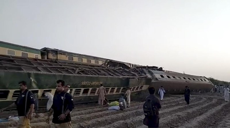 This image from a video, shows people gathering at the site of a train collision in Ghotki, Pakistan Monday, June 7, 2021. Two express trains collided in southern Pakistan early Monday, killing dozens of passengers, authorities said, as rescuers and villagers worked to pull injured people and more bodies from the wreckage. (AP Photo)