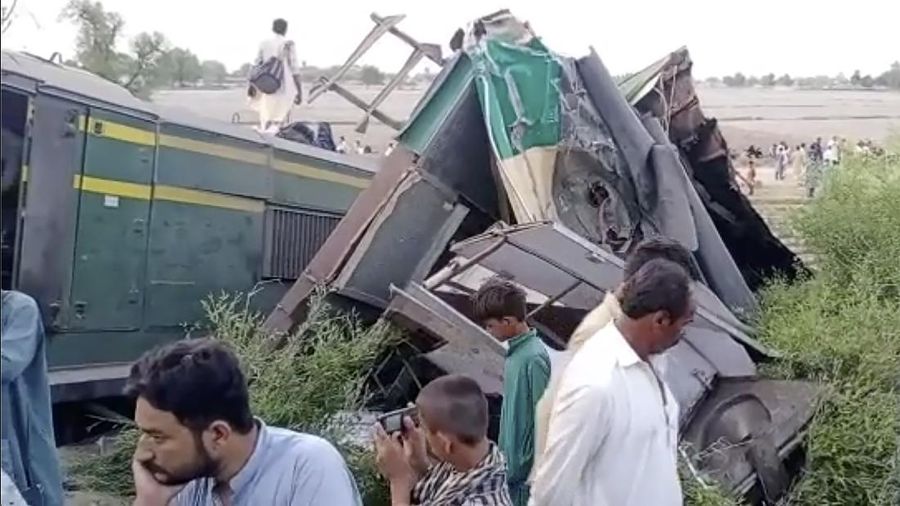 This image from a video, shows people gathering at the site of a train collision in Ghotki, Pakistan Monday, June 7, 2021. Two express trains collided in southern Pakistan early Monday, killing dozens of passengers, authorities said, as rescuers and villagers worked to pull injured people and more bodies from the wreckage. (AP Photo)