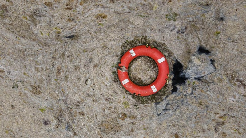 An aerial photo of the sea at the Caddebostan shore, in Asian side of Istanbul, Monday, June 7, 2021, with a huge mass of marine mucilage, a thick, slimy substance made up of compounds released by marine organisms, in Turkey's Marmara Sea. Turkey's President Recep Tayyip Erdogan promised Saturday to rescue the Marmara Sea from an outbreak of 