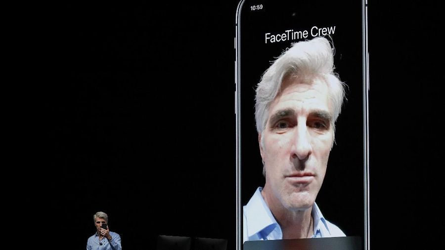 FILE - In this June 4, 2018 file photo, Craig Federighi, Apple's senior vice president of Software Engineering, speaks about group FaceTime during an announcement of new products at the Apple Worldwide Developers Conference in San Jose, Calif.  Apple says it has fixed the internal bug that led to people being able to eavesdrop on others while using its group video chat feature. It plans to turn the service back on next week via a software update. The bug allowed many iPhone users to turn an iPhone into a live microphone while using Group FaceTime. (AP Photo/Marcio Jose Sanchez, File)