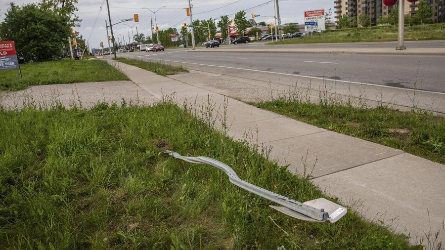 London Police investigate the scene of a car crash in London, Ontario on Monday, June 7, 2021. Police say multiple people have died after several pedestrians were struck by a car Sunday night. (Geoff Robins/The Canadian Press via AP)