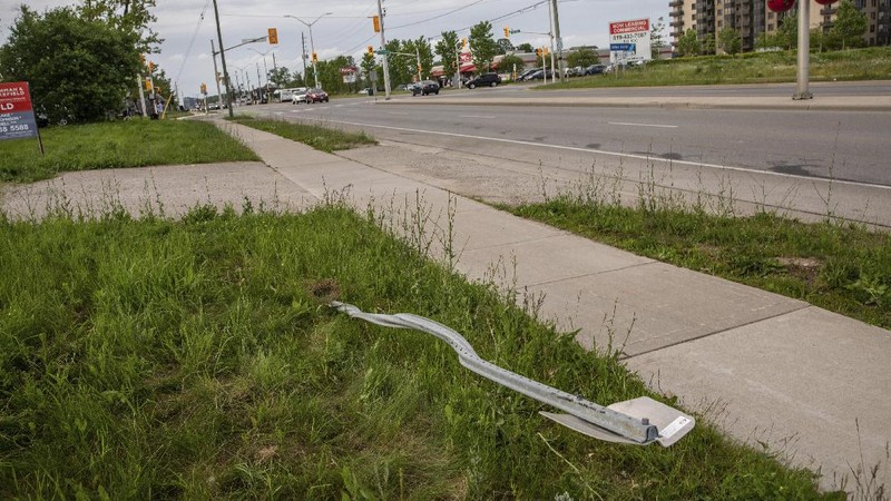 London Police investigate the scene of a car crash in London, Ontario on Monday, June 7, 2021. Police say multiple people have died after several pedestrians were struck by a car Sunday night. (Geoff Robins/The Canadian Press via AP)