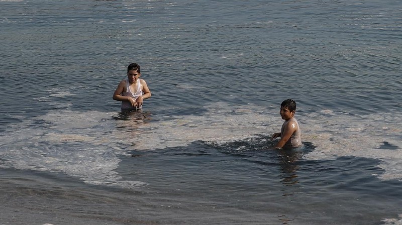 An aerial photo of the sea at the Caddebostan shore, in Asian side of Istanbul, Monday, June 7, 2021, with a huge mass of marine mucilage, a thick, slimy substance made up of compounds released by marine organisms, in Turkey's Marmara Sea. Turkey's President Recep Tayyip Erdogan promised Saturday to rescue the Marmara Sea from an outbreak of 