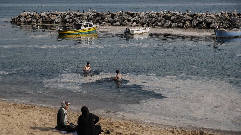 An aerial photo of the sea at the Caddebostan shore, in Asian side of Istanbul, Monday, June 7, 2021, with a huge mass of marine mucilage, a thick, slimy substance made up of compounds released by marine organisms, in Turkey's Marmara Sea. Turkey's President Recep Tayyip Erdogan promised Saturday to rescue the Marmara Sea from an outbreak of 