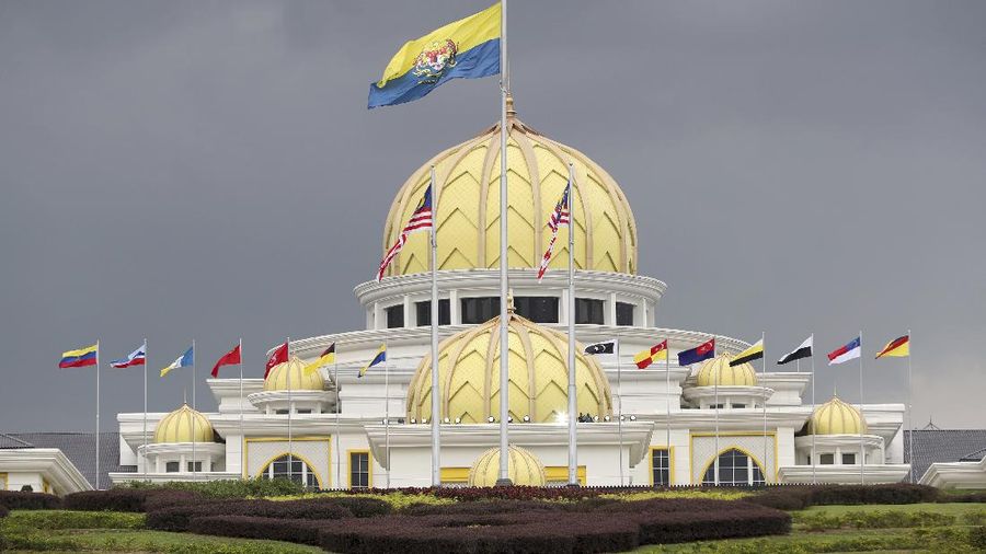 Flags fly at the Malaysia National Palace in Kuala Lumpur, Malaysia, Thursday, Jan. 24, 2019. King Sultan Muhammad V shocked the nation by announcing his abdication in January 2019, days after returning from two months of medical leave. The 49-year-old sultan from eastern Kelantan state only reigned for two years as Malaysia's 15th king and didn't give any reason for quitting. Sultan Abdullah Azlan Shah succeeded his ailing 88-year-old father on Jan. 15, in a move seen as paving the way for him to become the next king. (AP Photo/Vincent Thian)
