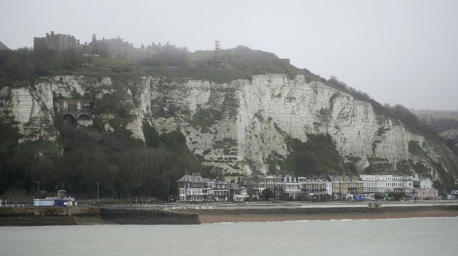 Tourists visit the White Cliffs of Dover, south east England, Thursday, June 9, 2016. On a clear day, the coast of France is visible from Dovers famous white cliffs, and they provided a vital vantage point for the early spotting of German bombers heading toward London during World War II. The concern now is not enemy attack, although an armed Russian submarine was recently intercepted in the Channel. Instead, it is Europeans who arrive legally under EU rules guaranteeing the free movement of people. (AP Photo/Matt Dunham)