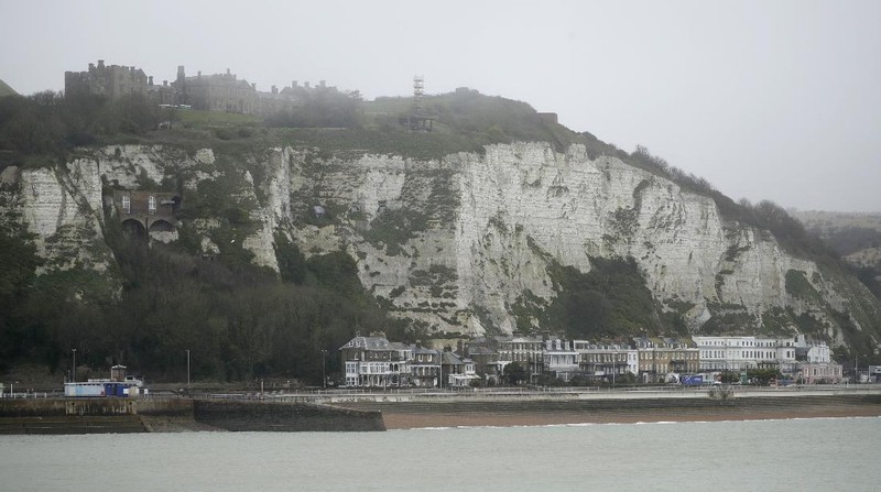 Tourists visit the White Cliffs of Dover, south east England, Thursday, June 9, 2016. On a clear day, the coast of France is visible from Dovers famous white cliffs, and they provided a vital vantage point for the early spotting of German bombers heading toward London during World War II. The concern now is not enemy attack, although an armed Russian submarine was recently intercepted in the Channel. Instead, it is Europeans who arrive legally under EU rules guaranteeing the free movement of people. (AP Photo/Matt Dunham)