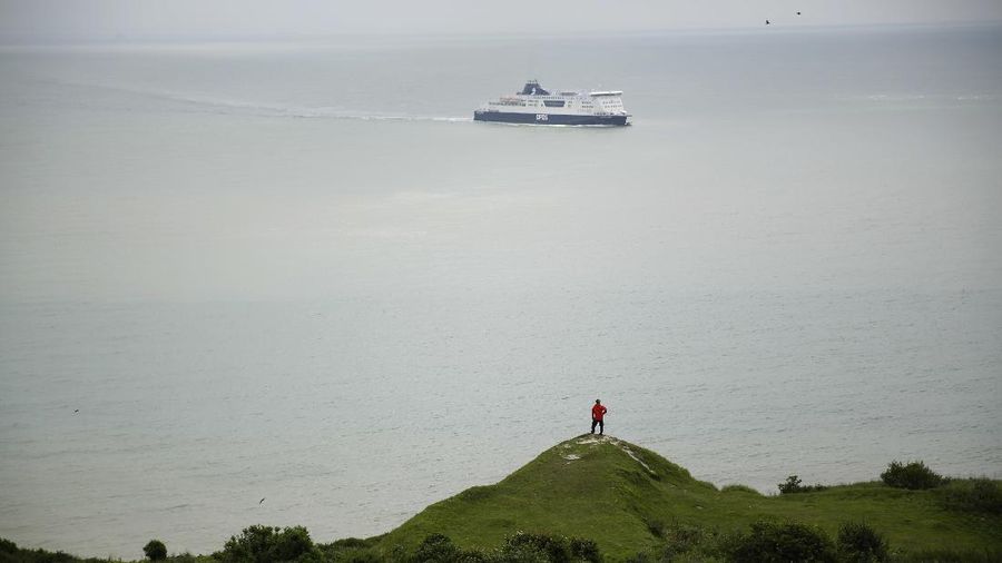 Tourists visit the White Cliffs of Dover, south east England, Thursday, June 9, 2016. On a clear day, the coast of France is visible from Dovers famous white cliffs, and they provided a vital vantage point for the early spotting of German bombers heading toward London during World War II. The concern now is not enemy attack, although an armed Russian submarine was recently intercepted in the Channel. Instead, it is Europeans who arrive legally under EU rules guaranteeing the free movement of people. (AP Photo/Matt Dunham)