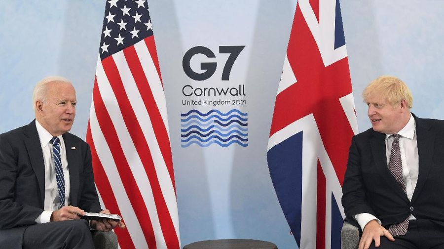 US President Joe Biden, left, talks with Britain's Prime Minister Boris Johnson, during their meeting ahead of the G7 summit in Cornwall, Britain, Thursday June 10, 2021. (Toby Melville/Pool Photo via AP)