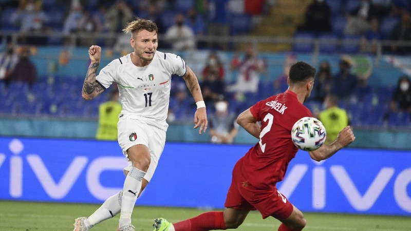 Italy's Ciro Immobile scores his side's second goal during the Euro 2020, soccer championship group A match between Italy and Turkey, at the Rome Olympic stadium, Friday, June 11, 2021. (Alfredo Falcone/LaPresse via AP)