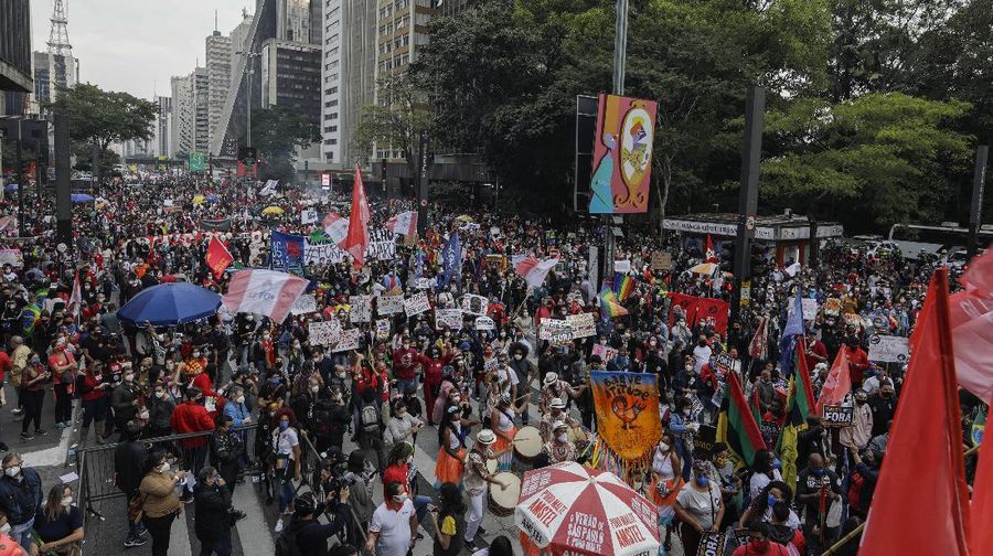 Demonstrators protest against Brazilian President Jair Bolsonaro and his handling of the COVID-19 pandemic on Paulista Avenue, in Sao Paulo, Brazil, Saturday, June 19, 2021. Brazil's COVID-19 death toll is expected to surpass the milestone of 500,000 deaths on Saturday night. (AP Photo/Marcelo Chello)