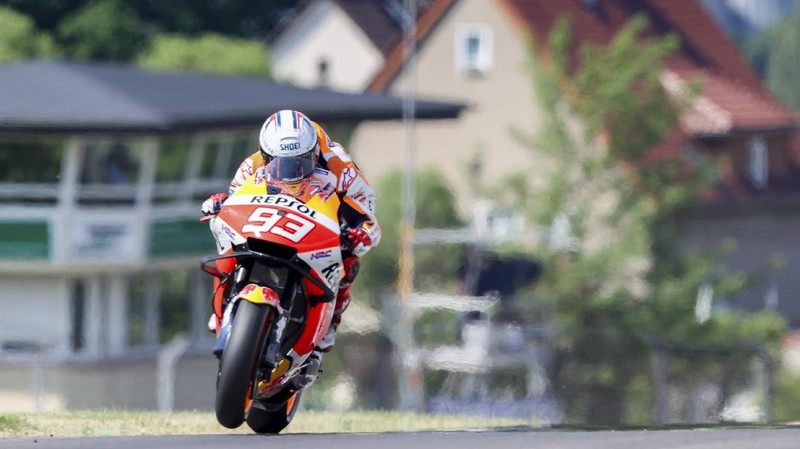 Spain's Marc Marquez of Repsol Honda Team, speeds at a free training session of the MotoGP in Hohenstein-Ernstthal, Germany, Friday, June 18, 2021. (Jan Woitas/dpa via AP)