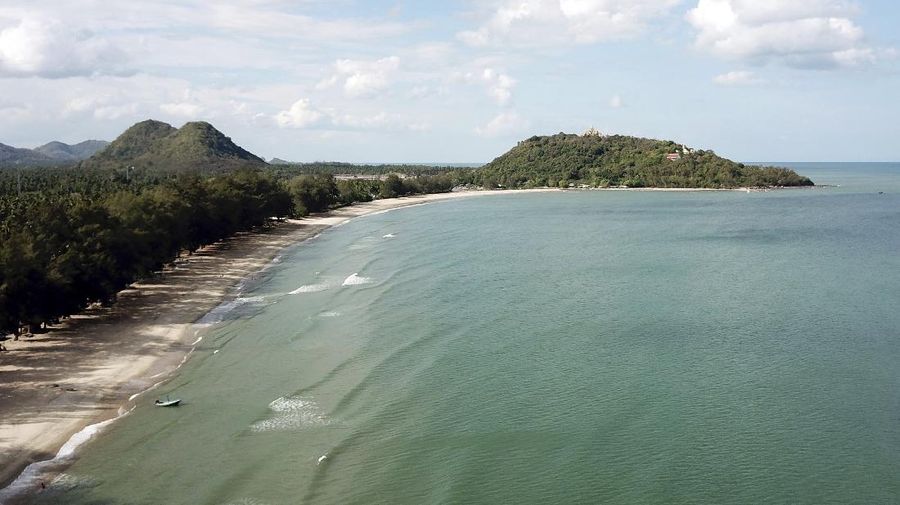 This June 15, 2019 photo shows Ban Krut beach in the Prachuap Khiri Khan province of Thailand. You won’t find the party scene of Phuket or Pattaya in laid-back Ban Krut, but you will get one of the cleanest and quietest stretches of white sand within driving distance of the capital. (AP Photo/Nicole Evatt)