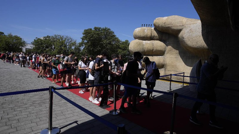Visitors ride a roller coaster at Cinecitta World amusement park in the outskirts of Rome in the day of its reopening, Thursday, June 17, 2021. Amusement parks have been closed since Oct. 25 2020, when Italy's second national lockdown started. (AP Photo/Alessandra Tarantino)