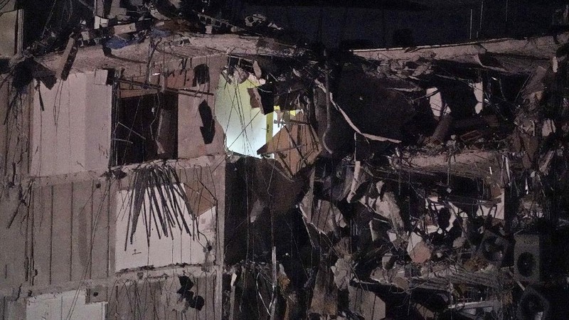 A partially collapsed building is seen early Thursday, June 24, 2021, in the Surfside area of Miami, Fla. A partial building collapse in Miami caused a massive response early Thursday from Miami Dade Fire Rescue, according to a tweet from the department's account. Miami Dade Fire Rescue is conducting search and rescue. Authorities had no word yet on casualties, or details of how many people lived in the building. (AP Photo/Wilfredo Lee)