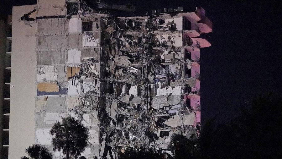 A partially collapsed building is seen early Thursday, June 24, 2021, in the Surfside area of Miami, Fla. A partial building collapse in Miami caused a massive response early Thursday from Miami Dade Fire Rescue, according to a tweet from the department's account. Miami Dade Fire Rescue is conducting search and rescue. Authorities had no word yet on casualties, or details of how many people lived in the building. (AP Photo/Wilfredo Lee)