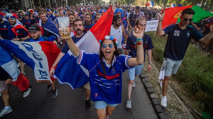 Portugal supporters unfurl a large flag before the Euro 2020 soccer championship group F match between Portugal and France at the Ferenc Puskas stadium in Budapest, Hungary, Wednesday, June 23, 2021. (AP Photo/Laszlo Balogh, Pool)