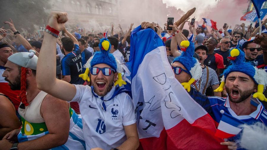 Portugal supporters unfurl a large flag before the Euro 2020 soccer championship group F match between Portugal and France at the Ferenc Puskas stadium in Budapest, Hungary, Wednesday, June 23, 2021. (AP Photo/Laszlo Balogh, Pool)