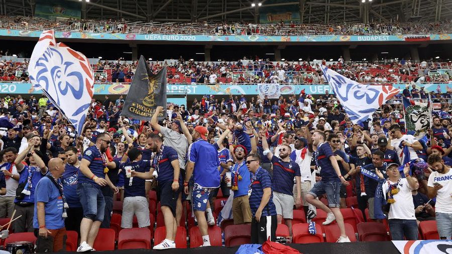Portugal supporters unfurl a large flag before the Euro 2020 soccer championship group F match between Portugal and France at the Ferenc Puskas stadium in Budapest, Hungary, Wednesday, June 23, 2021. (AP Photo/Laszlo Balogh, Pool)
