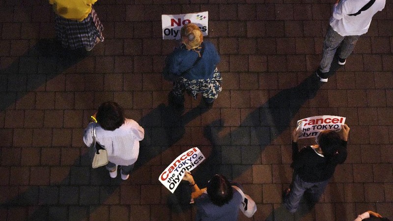Protestors call for the cancelation of the Tokyo Olympics slated to start in 30 days, near the Tokyo Metropolitan Government building Wednesday, June 23, 2021, in Tokyo. (AP Photos/Kantaro Komiya)