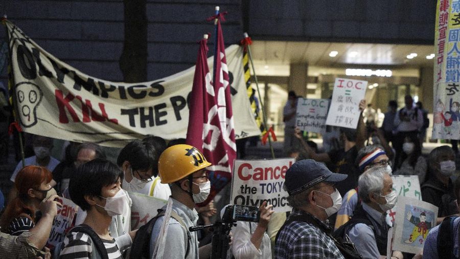 Protestors call for the cancelation of the Tokyo Olympics slated to start in 30 days, near the Tokyo Metropolitan Government building Wednesday, June 23, 2021, in Tokyo. (AP Photos/Kantaro Komiya)