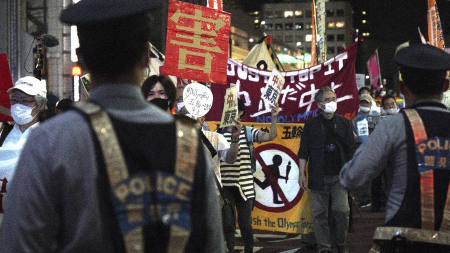 Protestors call for the cancelation of the Tokyo Olympics slated to start in 30 days, near the Tokyo Metropolitan Government building Wednesday, June 23, 2021, in Tokyo. (AP Photos/Kantaro Komiya)