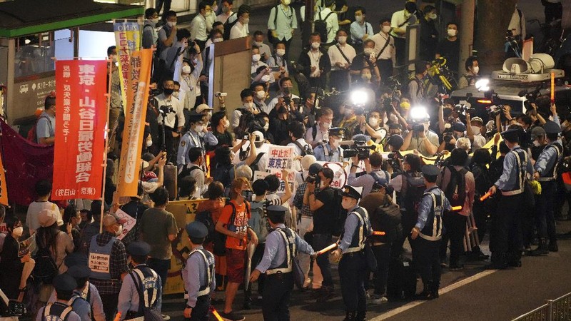 Protestors call for the cancelation of the Tokyo Olympics slated to start in 30 days, near the Tokyo Metropolitan Government building Wednesday, June 23, 2021, in Tokyo. (AP Photos/Kantaro Komiya)