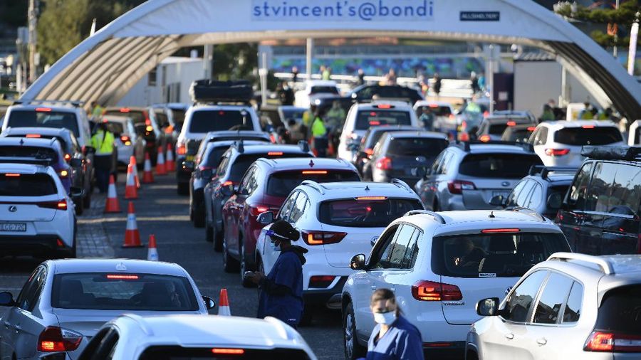 People queue in their cars to get tested for COVID-19 at a pop-up testing clinic at Bondi Beach in Sydney Friday, June 25, 2021. Parts of Sydney will go into lockdown late Friday after a coronavirus outbreak in Australia’s largest city continued to grow. (Dean Lewins/AAP Image via AP)
