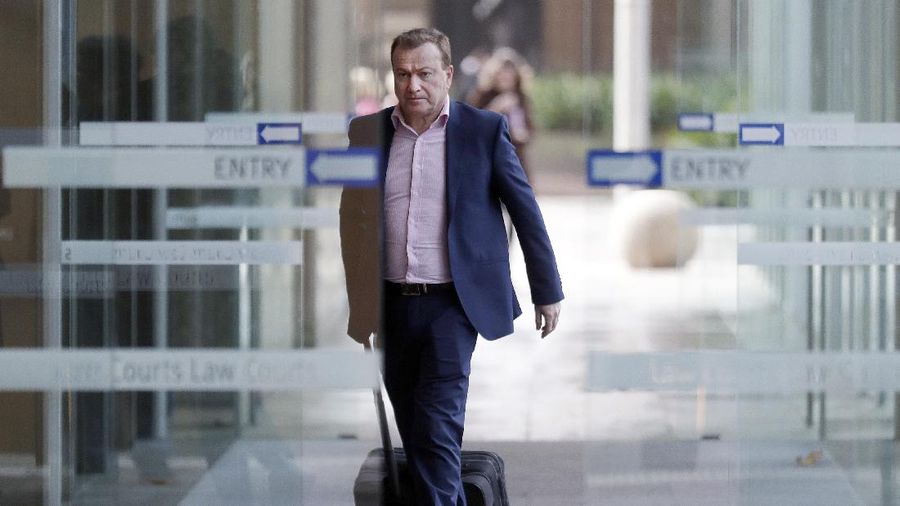 FILE - In this May 6, 2021, file photo, Andrew Cooper, founder and president of libertarian group LibertyWorks, arrives at Federal Court in Sydney. An Australian court on Tuesday, June 1, 2021, has rejected a challenge to the federal government's draconian power to prevent most citizens from leaving the country so that they don't bring COVID-19 home. (AP Photo/Rick Rycroft, File)