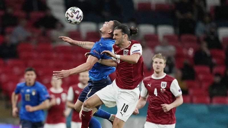 Denmark's Martin Braithwaite, centre, makes an attempt to score during the Euro 2020 soccer championship round of 16 match between Wales and Denmark at Johan Cruyff ArenA in Amsterdam, Netherlands, Saturday, June 26, 2021. (Olaf Kraak/Pool via AP)