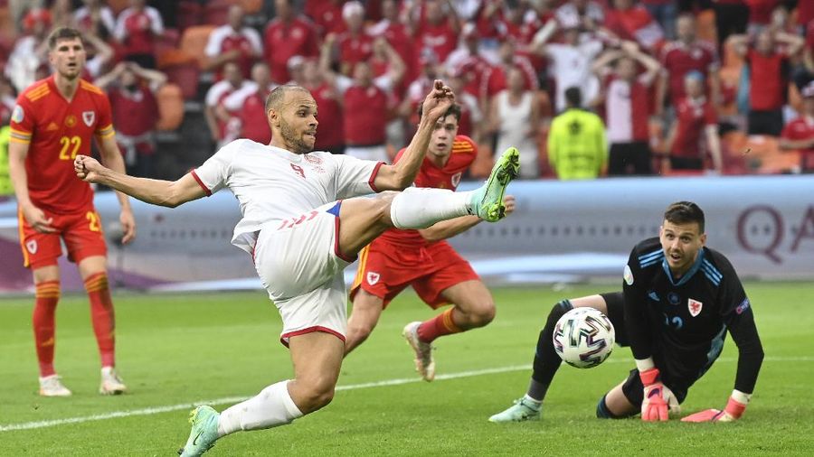 Denmark's Martin Braithwaite, centre, makes an attempt to score during the Euro 2020 soccer championship round of 16 match between Wales and Denmark at Johan Cruyff ArenA in Amsterdam, Netherlands, Saturday, June 26, 2021. (Olaf Kraak/Pool via AP)