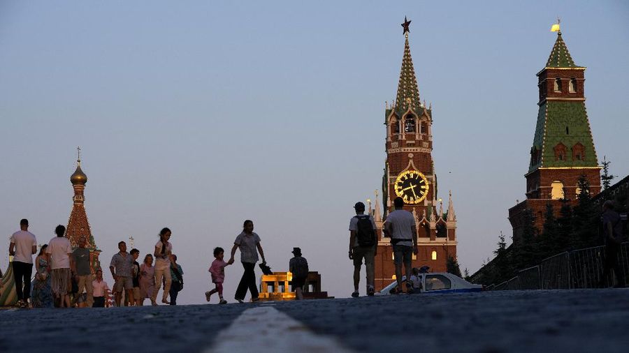 People walk through Red Square after a hot day in Moscow, Russia, Thursday, June 24, 2021. Residents of Russia's capital are wilting under hot temperatures that on Thursday hit an all-time high for June since records started being kept. The mid-afternoon temperature of 36 Celsius (96,8 Fahrenheit). (AP Photo/Alexander Zemlianichenko)