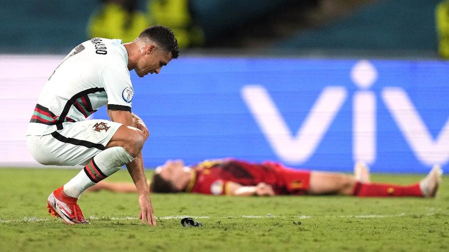 Portugal's Cristiano Ronaldo reacts during the Euro 2020 soccer championship round of 16 match between Belgium and Portugal at the La Cartuja stadium in Seville, Spain,Sunday, June 27, 2021. (AP Photo/Thanassis Stavrakis, Pool)
