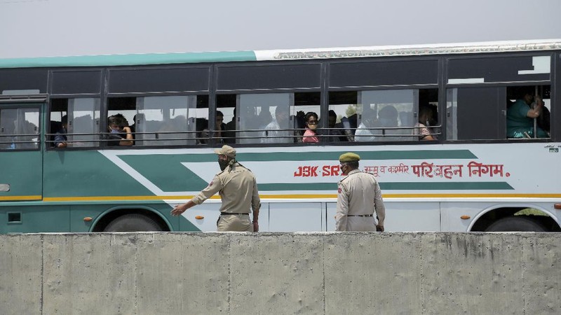 Security personnel check vehicles on the Jammu-Pathankot highway after troops around midnight spotted two drones separately flying over Kaluchak military base on the outskirts of Jammu, India, Monday, June 28, 2021. India's military said it thwarted a major threat when it intercepted two drones flying over an army base in Indian-controlled Kashmir early Monday, a day after suspected explosives-laden drones were used to attack an air base in the disputed region. (AP Photo/Channi Anand)