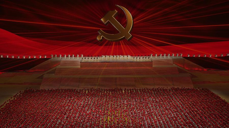 Chinese President Xi Jinping is displayed on a screen as performers dance at a gala show ahead of the 100th anniversary of the founding of the Chinese Communist Party in Beijing on Monday, June 28, 2021. China is marking the centenary of its ruling Communist Party this week by heralding what it says is its growing influence abroad, along with success in battling corruption at home. Party officials on Monday heaped praise on President Xi Jinping, who has established himself as China's most powerful leader since Mao Zedong, and has eliminated any limits on his term in office. (AP Photo/Ng Han Guan)