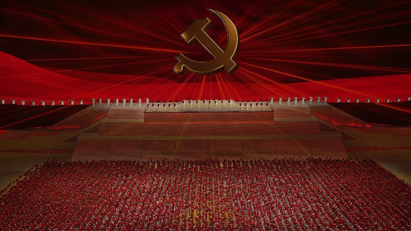 Chinese President Xi Jinping is displayed on a screen as performers dance at a gala show ahead of the 100th anniversary of the founding of the Chinese Communist Party in Beijing on Monday, June 28, 2021. China is marking the centenary of its ruling Communist Party this week by heralding what it says is its growing influence abroad, along with success in battling corruption at home. Party officials on Monday heaped praise on President Xi Jinping, who has established himself as China's most powerful leader since Mao Zedong, and has eliminated any limits on his term in office. (AP Photo/Ng Han Guan)