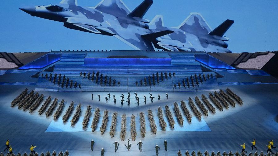 Chinese President Xi Jinping is displayed on a screen as performers dance at a gala show ahead of the 100th anniversary of the founding of the Chinese Communist Party in Beijing on Monday, June 28, 2021. China is marking the centenary of its ruling Communist Party this week by heralding what it says is its growing influence abroad, along with success in battling corruption at home. Party officials on Monday heaped praise on President Xi Jinping, who has established himself as China's most powerful leader since Mao Zedong, and has eliminated any limits on his term in office. (AP Photo/Ng Han Guan)