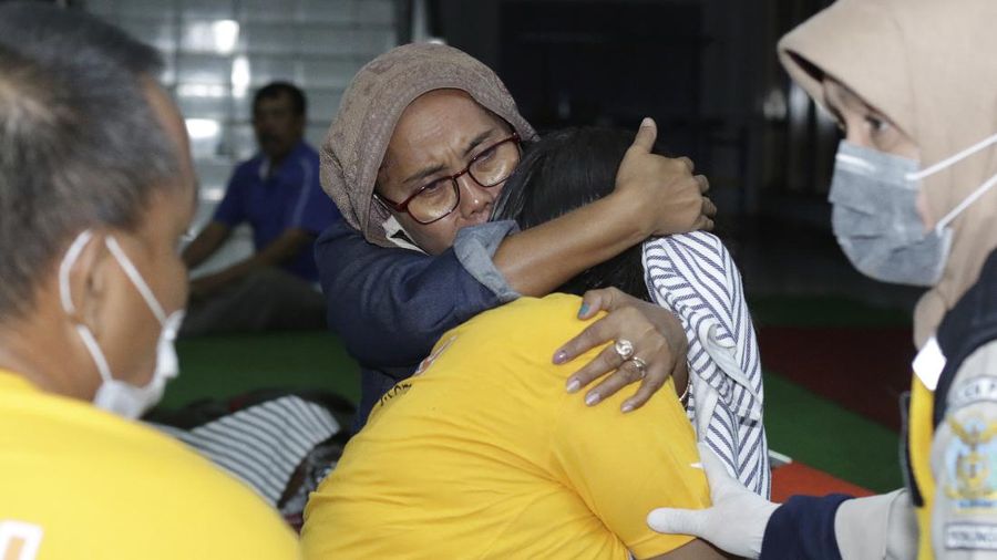 Indonesian Navy personnel prepare for a search rescue operation for victims of the sinking ferry KMP Yunice near Gilimanuk Port on Bali Island, Indonesia, Wednesday, June 30, 2021. Rescuers on Wednesday were searching for people missing in rough seas overnight. (AP Photo/Fauzy Chaniago)