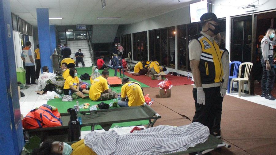 Indonesian Navy personnel prepare for a search rescue operation for victims of the sinking ferry KMP Yunice near Gilimanuk Port on Bali Island, Indonesia, Wednesday, June 30, 2021. Rescuers on Wednesday were searching for people missing in rough seas overnight. (AP Photo/Fauzy Chaniago)