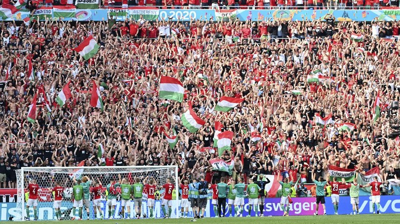 England fans celebrate during the Euro 2020 soccer championship round of 16 match between England and Germany at Wembley Stadium in England, Tuesday June 29, 2021. (Justin Tallis, Pool Photo via AP)