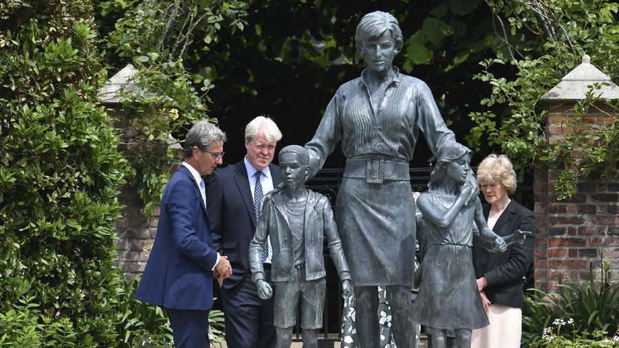 Britain's Prince William and Prince Harry arrive for the statue unveiling on what woud have been Princess Diana's 60th birthday, in the Sunken Garden at Kensington Palace, London, Thursday July 1, 2021. (Yui Mok/Pool Photo via AP)