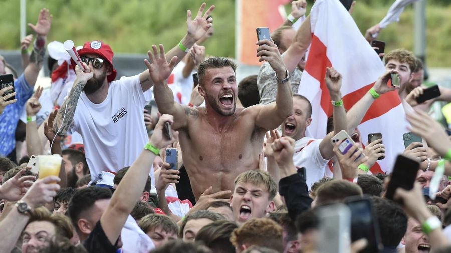 English supporters celebrate at 4TheFans Fan Park, in Manchester, England, Tuesday, June 29, 2021 after England won the Euro 2020 round of 16 soccer championship match between England and Germany at Wembley Stadium in London. (AP Photo/Rui Vieira)