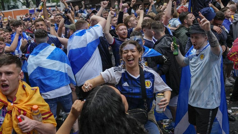 England fans celebrate during the Euro 2020 soccer championship round of 16 match between England and Germany at Wembley Stadium in England, Tuesday June 29, 2021. (Justin Tallis, Pool Photo via AP)